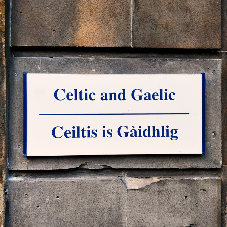 A sign saying "Celtic and Irish", in both English and Scots Gaelic on a building of the University of Glasgow, Glasgow Scotland